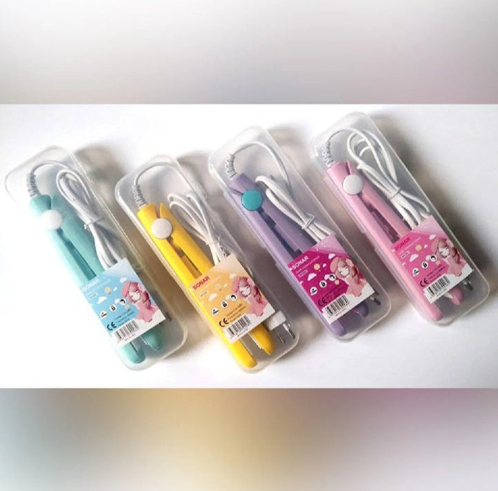 Set of colorful earbuds in clear cases on a white background